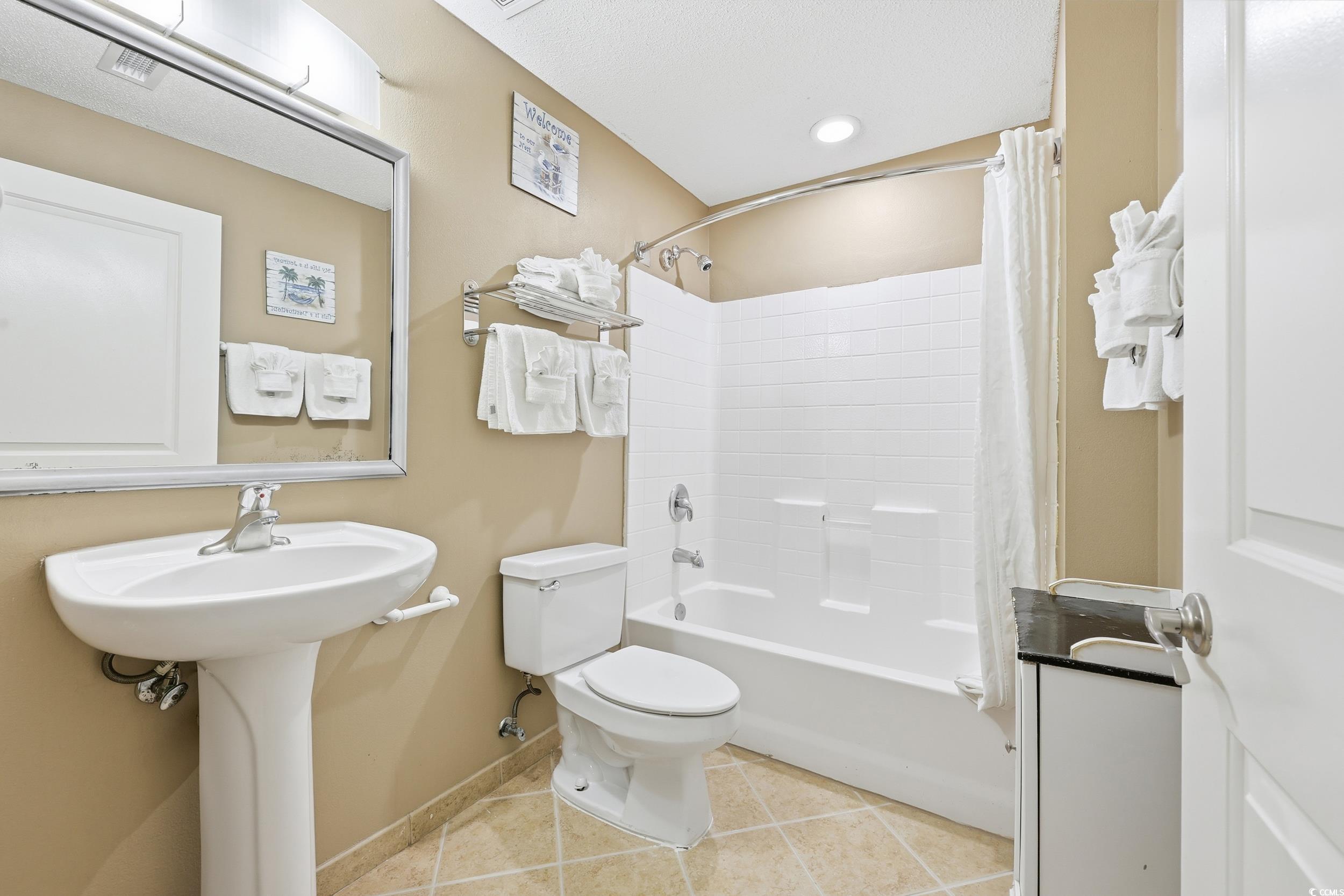 300 North Ocean Boulevard, Unit 1608 North Myrtle Beach, SC 29582 - Photo 21 of 30 Bathroom with light tile patterned flooring, shower / bath combo with shower curtain, and recessed lighting