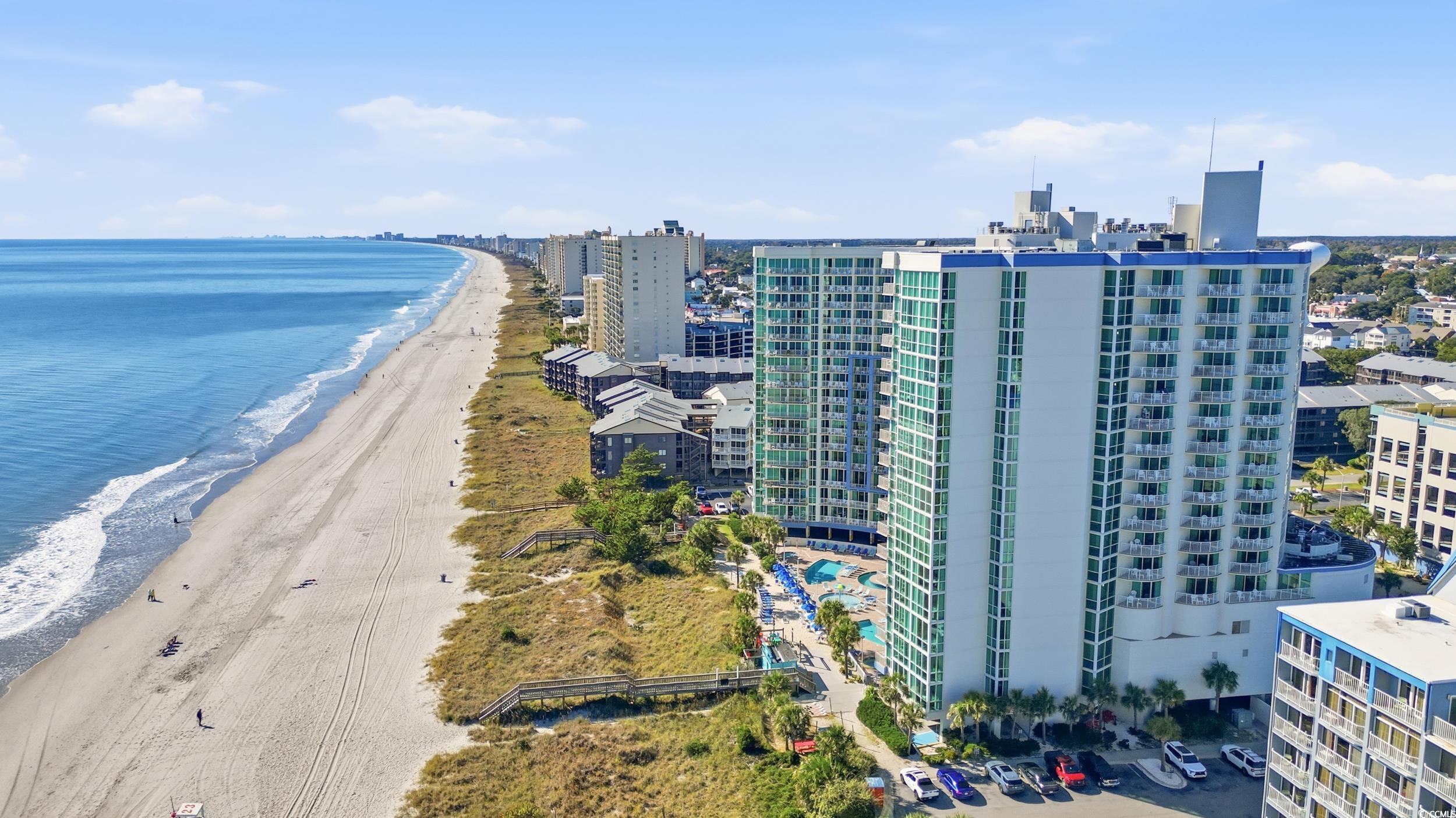 300 North Ocean Boulevard, Unit 1608 North Myrtle Beach, SC 29582 - Photo 29 of 30 Drone / aerial view of waterfront with a beach and apartment complex / building