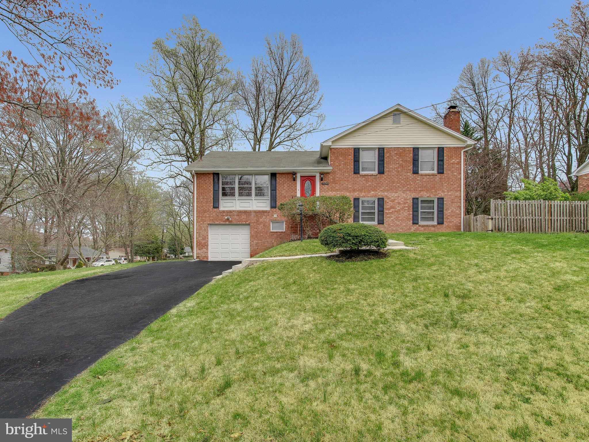 13245 Glenhill Road Silver Spring, MD 20904 - Photo 1 of 30 a front view of a house with a yard and garage