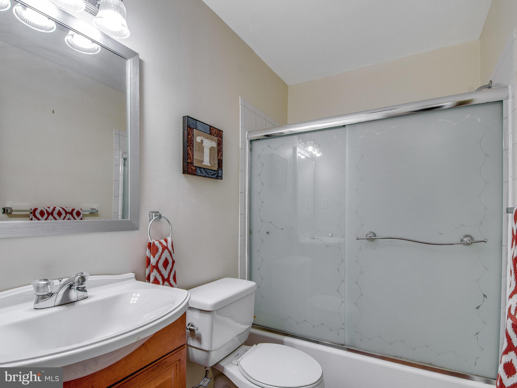 13245 Glenhill Road Silver Spring, MD 20904 - Photo 14 of 30 a bathroom with a sink toilet and a mirror