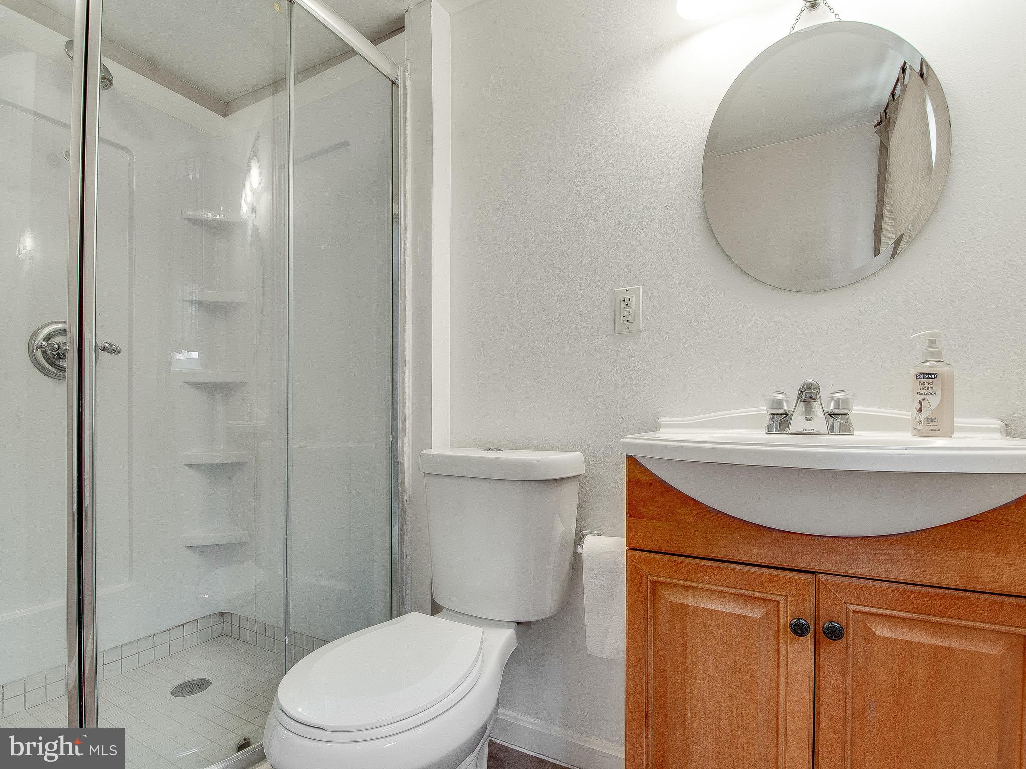 13245 Glenhill Road Silver Spring, MD 20904 - Photo 22 of 30 a bathroom with a sink toilet and shower