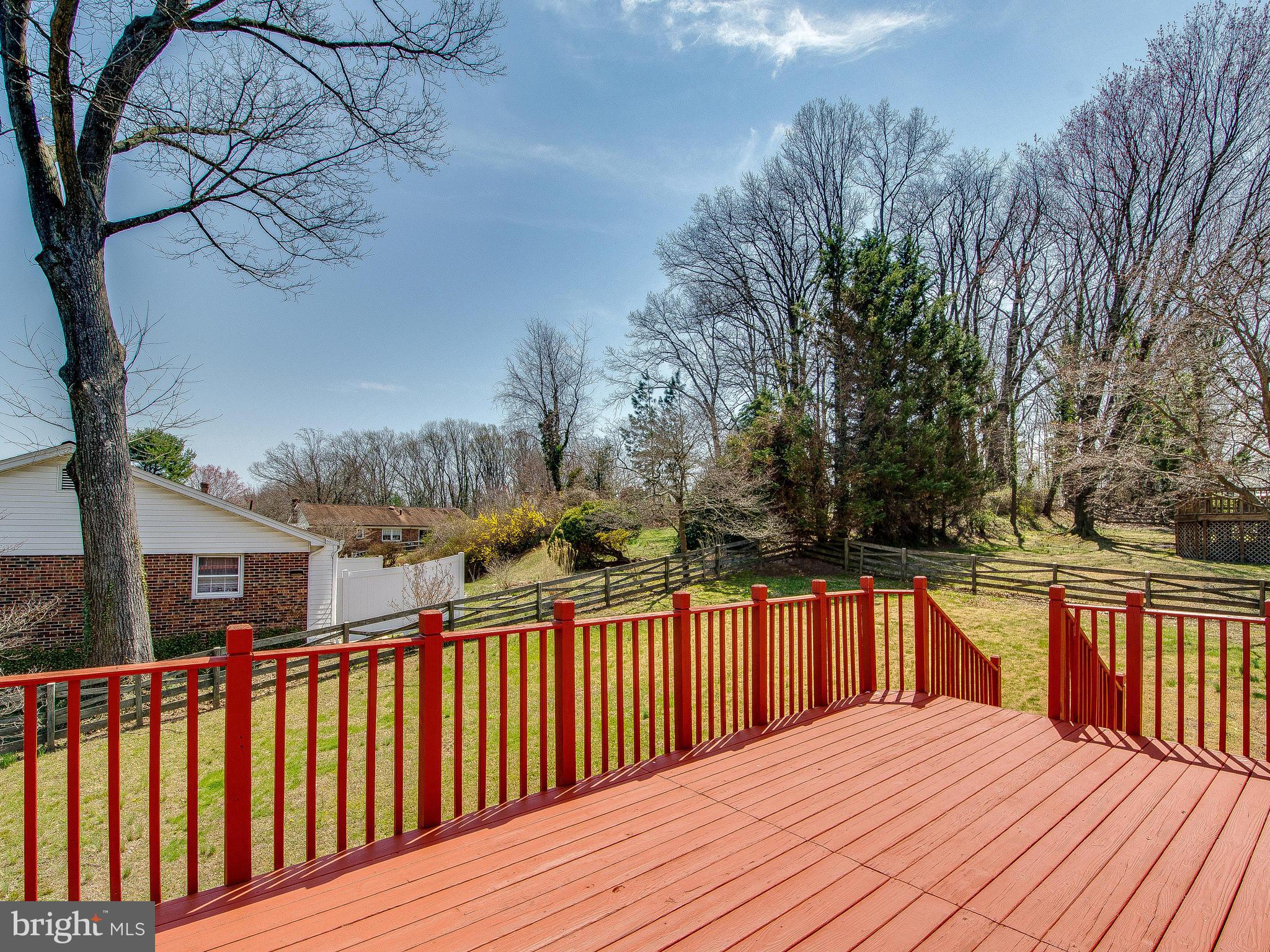 13245 Glenhill Road Silver Spring, MD 20904 - Photo 26 of 30 a balcony with wooden floor and fence