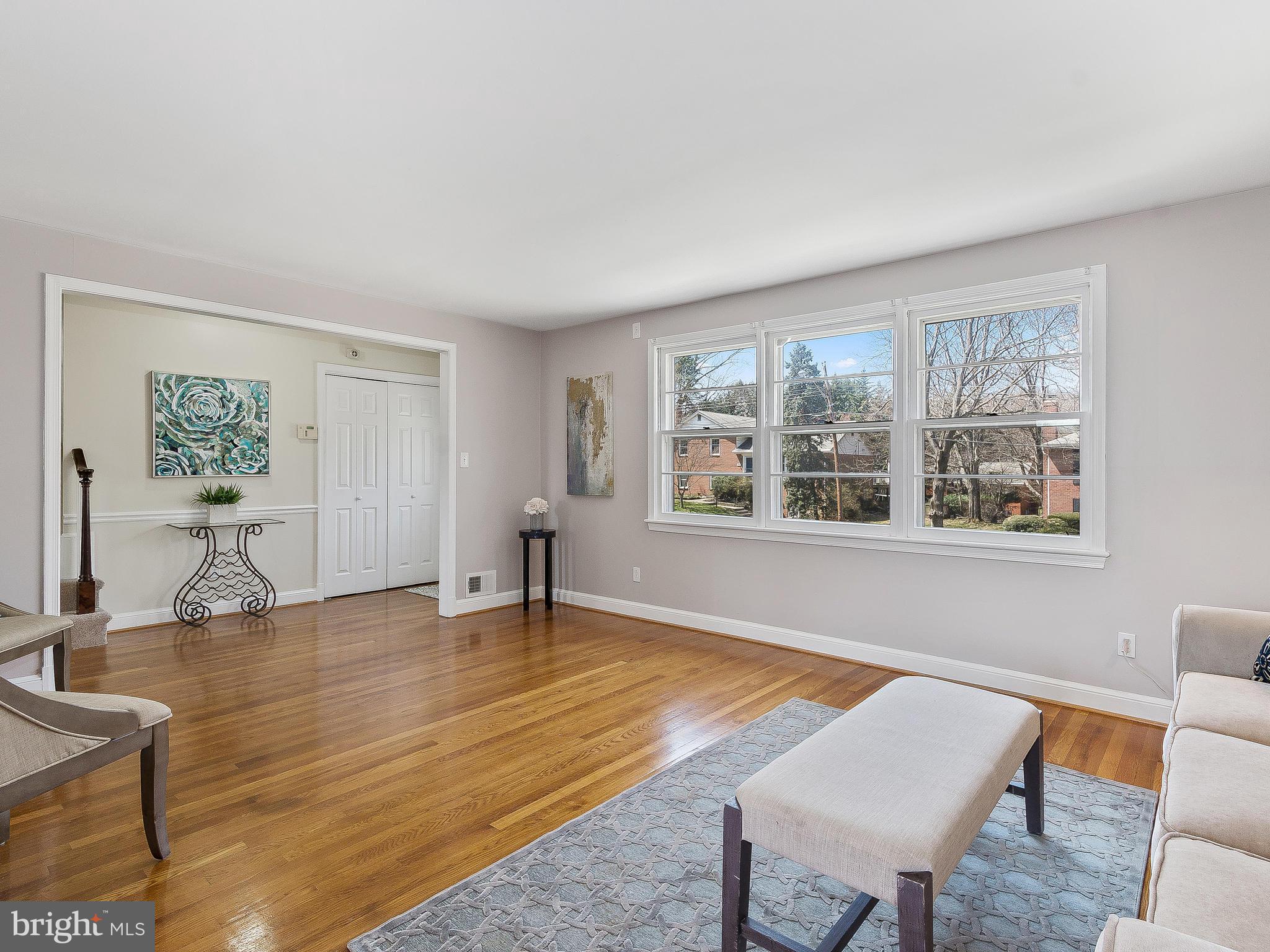 13245 Glenhill Road Silver Spring, MD 20904 - Photo 6 of 30 a view of an empty room with wooden floor and a window