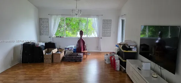 a living room with furniture and a window