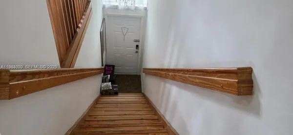 a view of a balcony with wooden floor