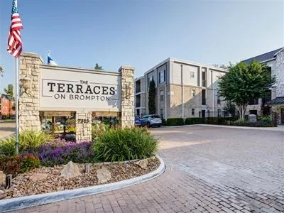 a view of a building with potted plants