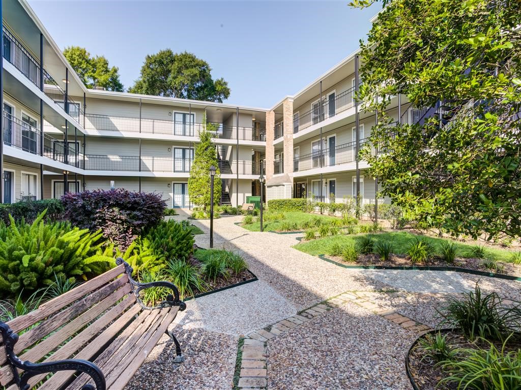 7315 Brompton Street, Unit 342B Houston, TX 77025 - Photo 14 of 17 a front view of a house with a yard