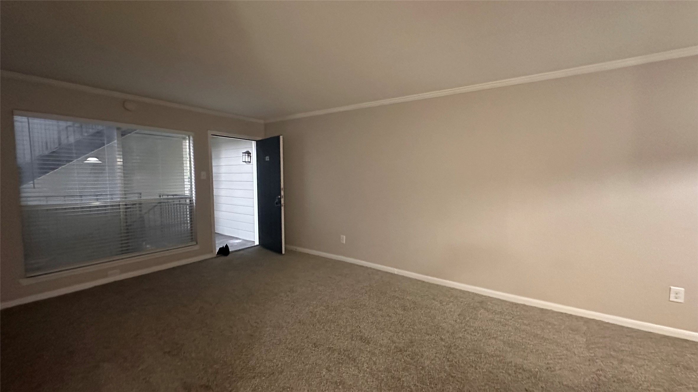 7315 Brompton Street, Unit 342B Houston, TX 77025 - Photo 2 of 17 an empty room with sliding glass door