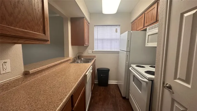a bathroom with a sink a washer and dryer