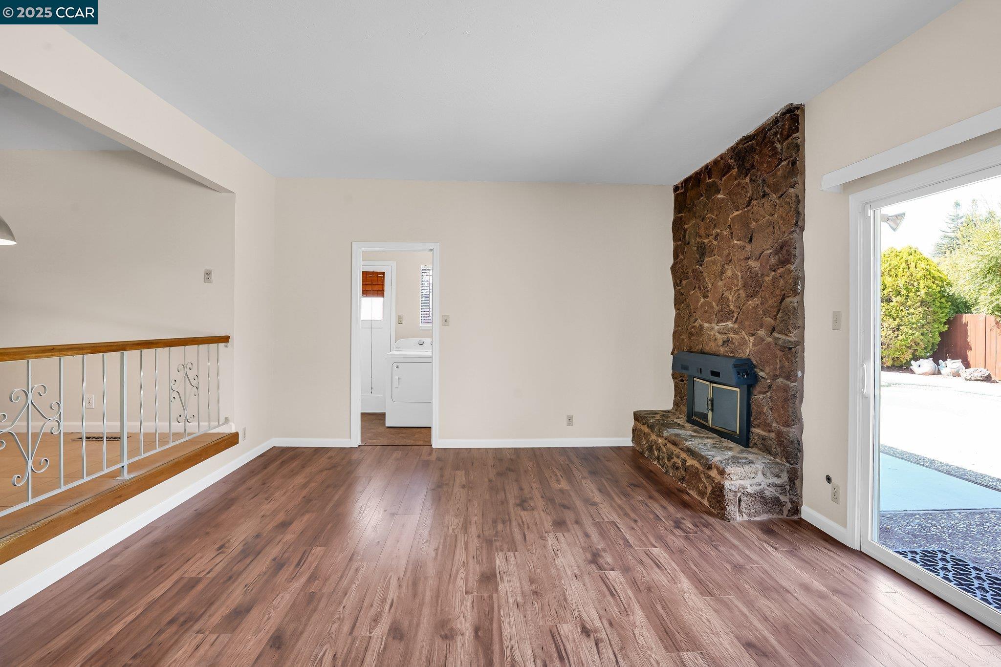 348 Barrett Circle Danville, CA 94526 - Photo 11 of 41 a view of empty room with wooden floor and fireplace
