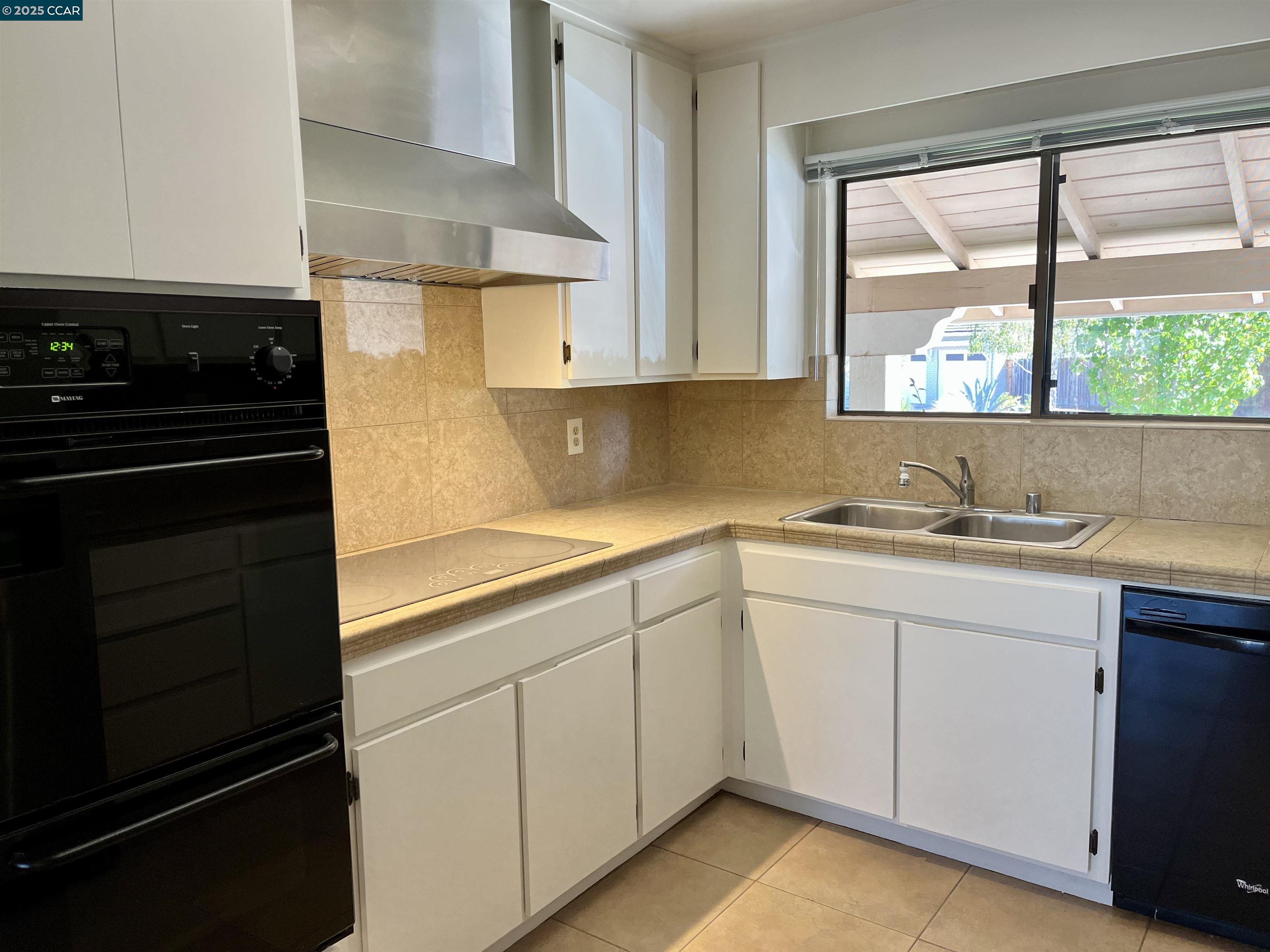 348 Barrett Circle Danville, CA 94526 - Photo 15 of 41 a kitchen with a sink stove and cabinets