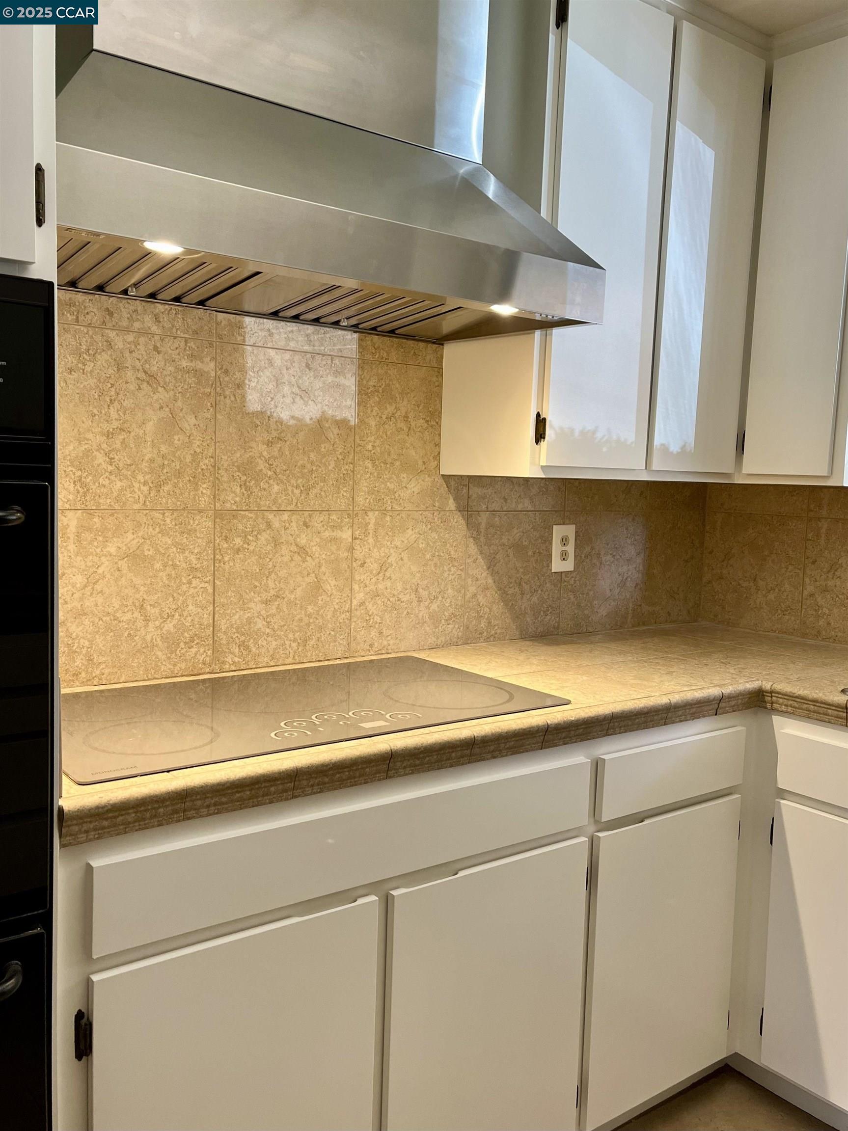 348 Barrett Circle Danville, CA 94526 - Photo 17 of 41 a view of a refrigerator in kitchen