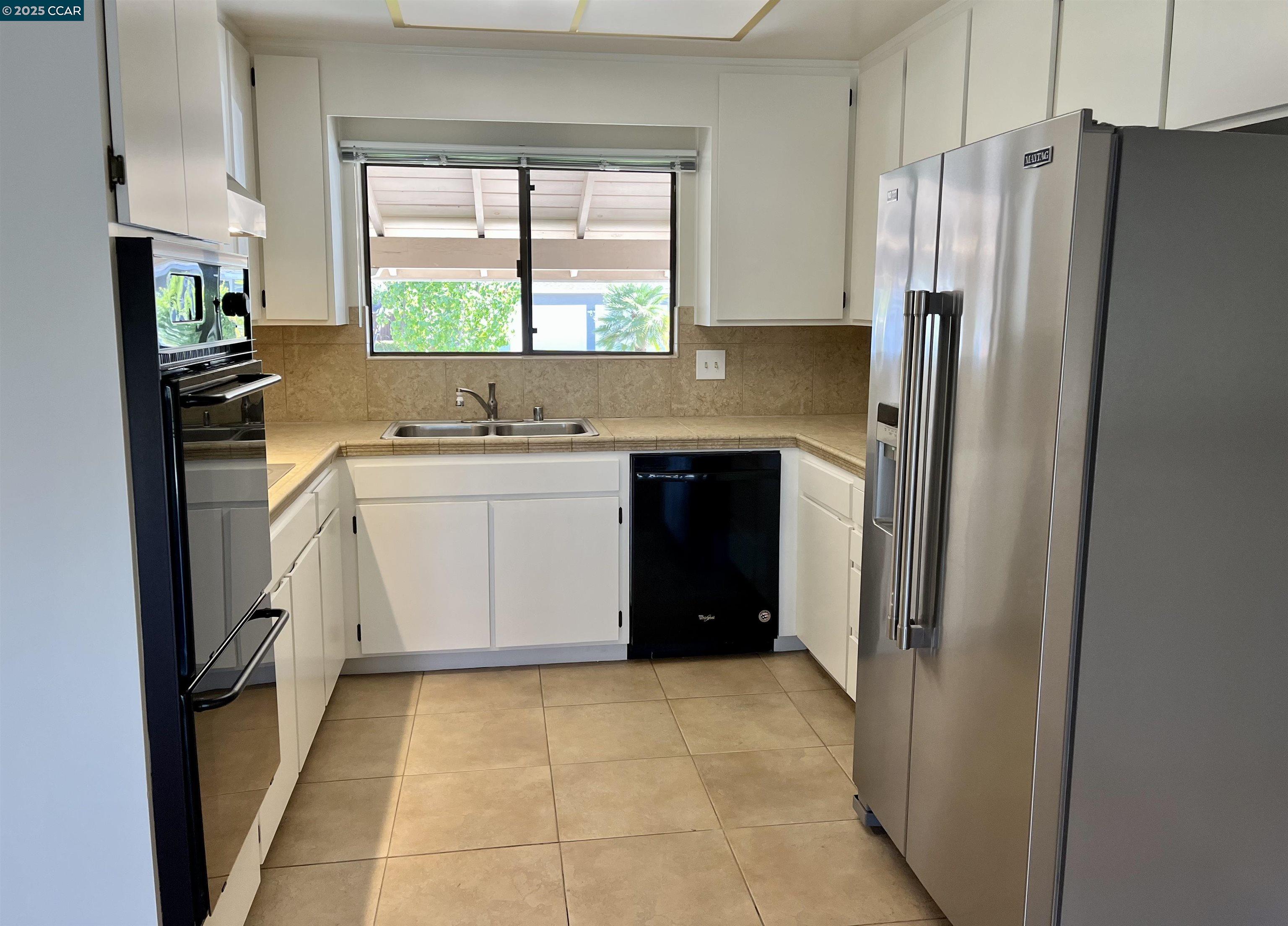 348 Barrett Circle Danville, CA 94526 - Photo 19 of 41 a kitchen with stainless steel appliances a refrigerator sink and microwave