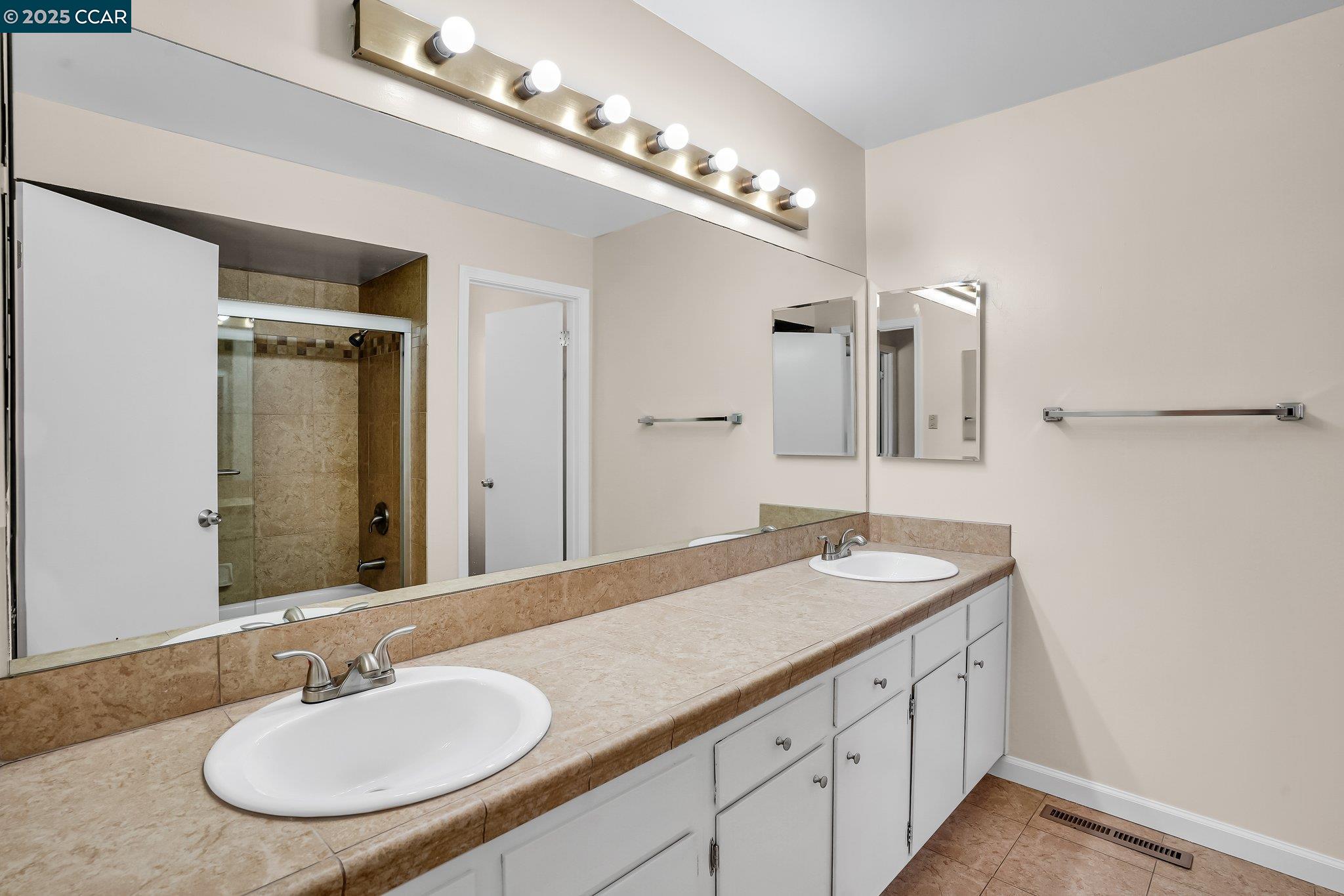 348 Barrett Circle Danville, CA 94526 - Photo 21 of 41 a bathroom with a granite countertop sink and a mirror