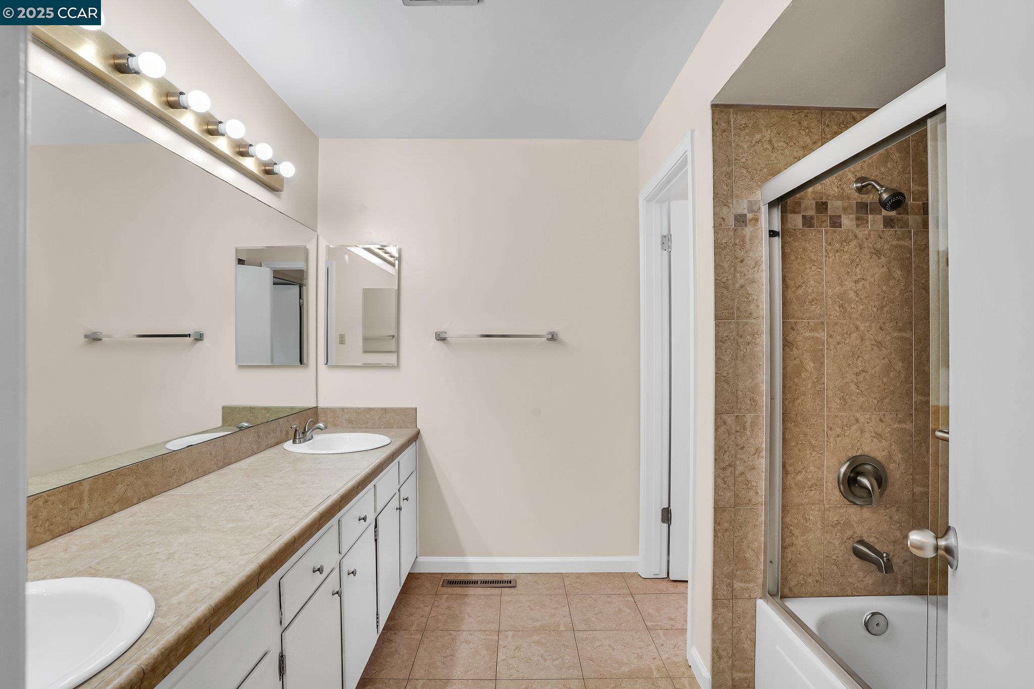 348 Barrett Circle Danville, CA 94526 - Photo 22 of 41 a bathroom with a granite countertop double vanity sink mirror and shower
