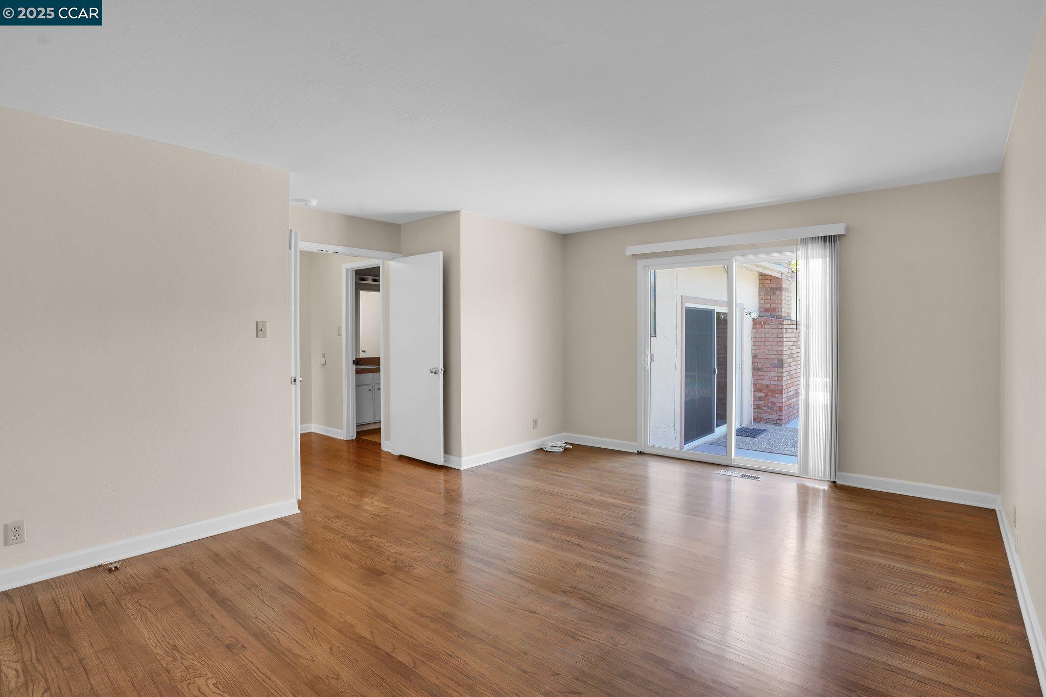 348 Barrett Circle Danville, CA 94526 - Photo 26 of 41 a view of an empty room with wooden floor and a window
