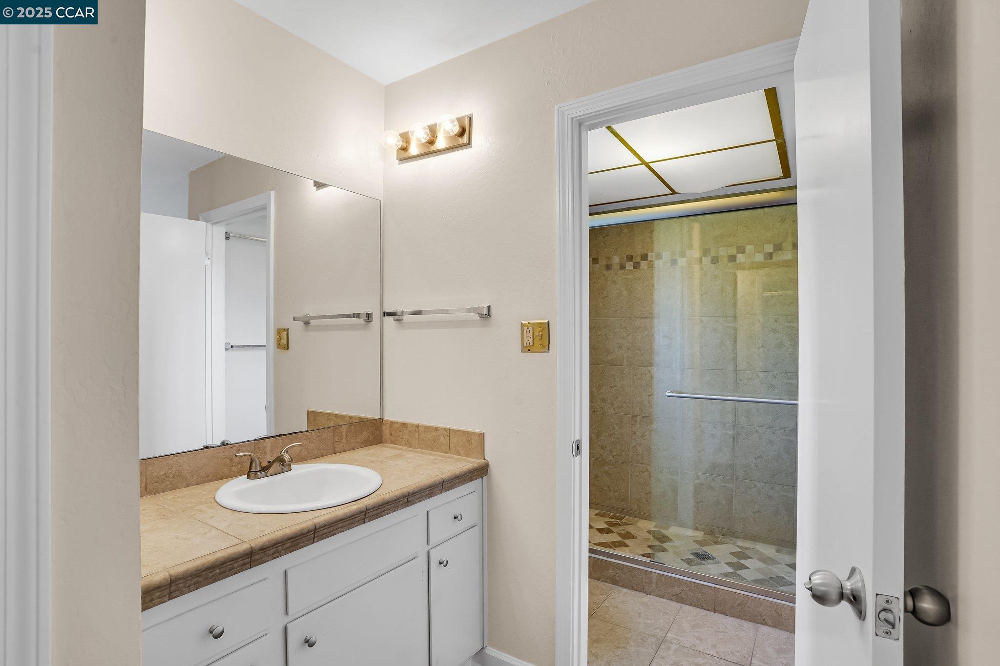 348 Barrett Circle Danville, CA 94526 - Photo 27 of 41 a bathroom with a sink and a mirror