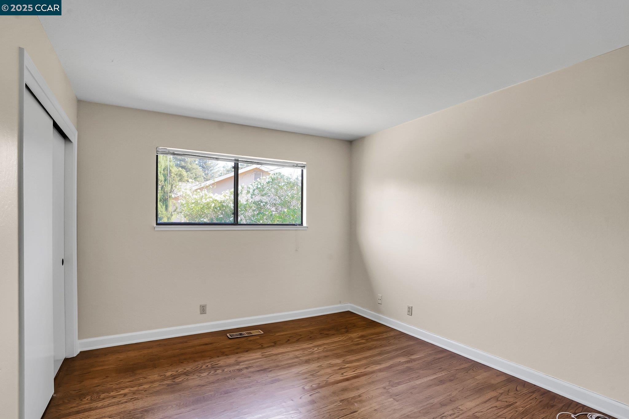 348 Barrett Circle Danville, CA 94526 - Photo 28 of 41 an empty room with wooden floor and window