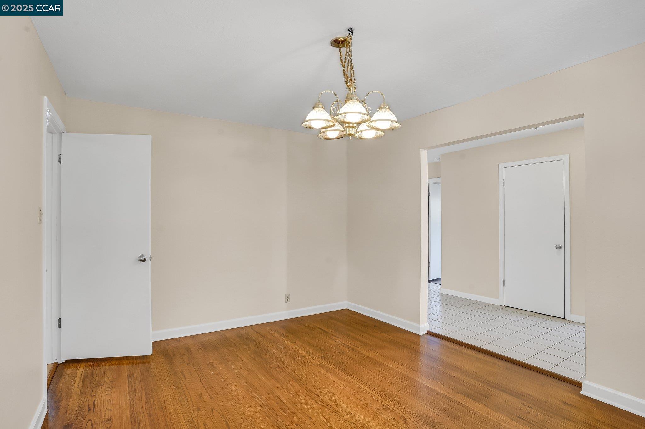 348 Barrett Circle Danville, CA 94526 - Photo 6 of 41 a view of a chandelier fan and wooden floor