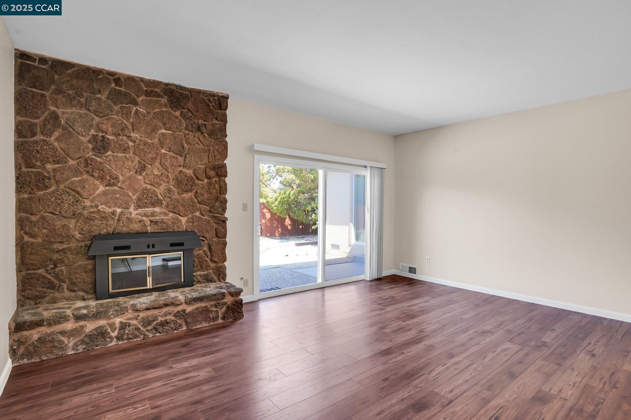 348 Barrett Circle Danville, CA 94526 - Photo 10 of 41 wooden floor fireplace and natural light in room