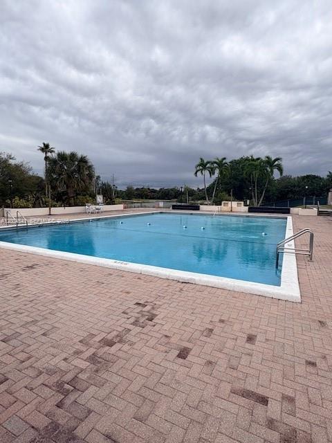 4174 Inverrary Drive, Unit 914 Lauderhill, FL 33319 - Photo 12 of 13 a view of a swimming pool and a yard