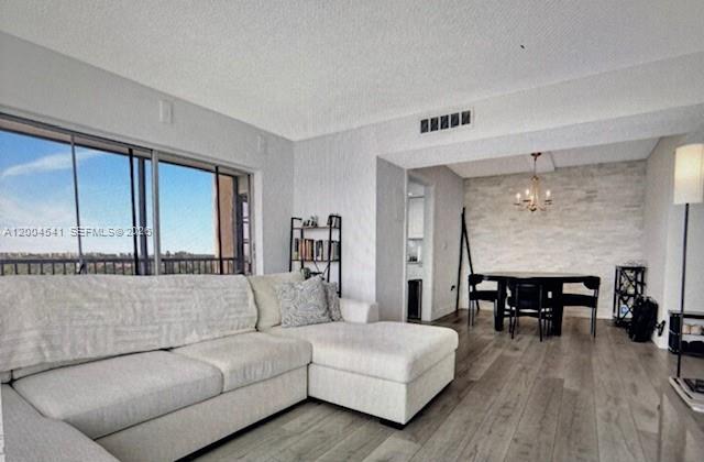 4174 Inverrary Drive, Unit 914 Lauderhill, FL 33319 - Photo 2 of 13 a living room with furniture and wooden floor