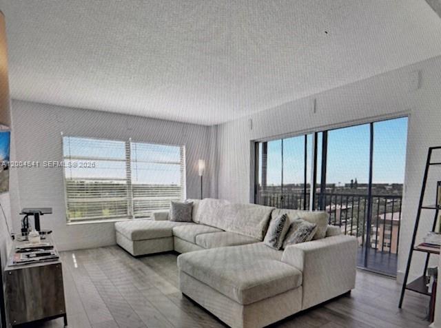 4174 Inverrary Drive, Unit 914 Lauderhill, FL 33319 - Photo 4 of 13 a living room with furniture and large windows