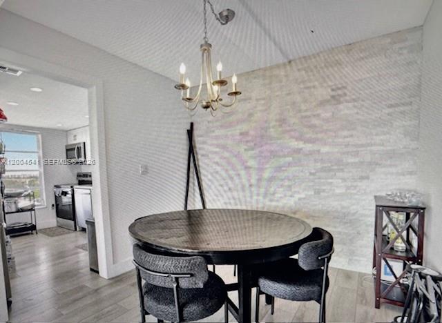 4174 Inverrary Drive, Unit 914 Lauderhill, FL 33319 - Photo 6 of 13 a view of a dining room with furniture and wooden floor