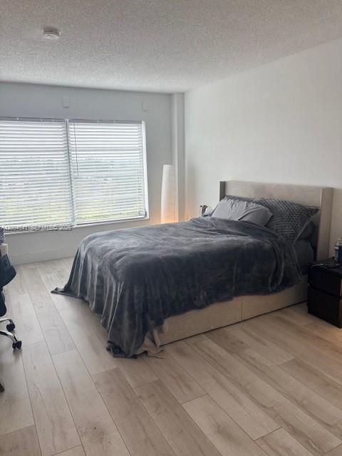 4174 Inverrary Drive, Unit 914 Lauderhill, FL 33319 - Photo 7 of 13 a bedroom with a bed and a large window