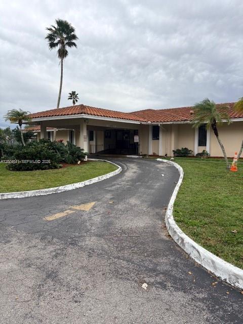 4174 Inverrary Drive, Unit 914 Lauderhill, FL 33319 - Photo 10 of 13 a front view of house with yard and green space