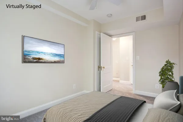 a bedroom with a bed and a couch