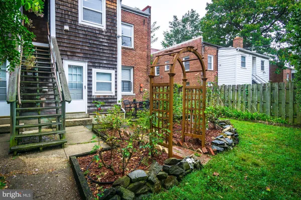 a view of a house with a garden and plants