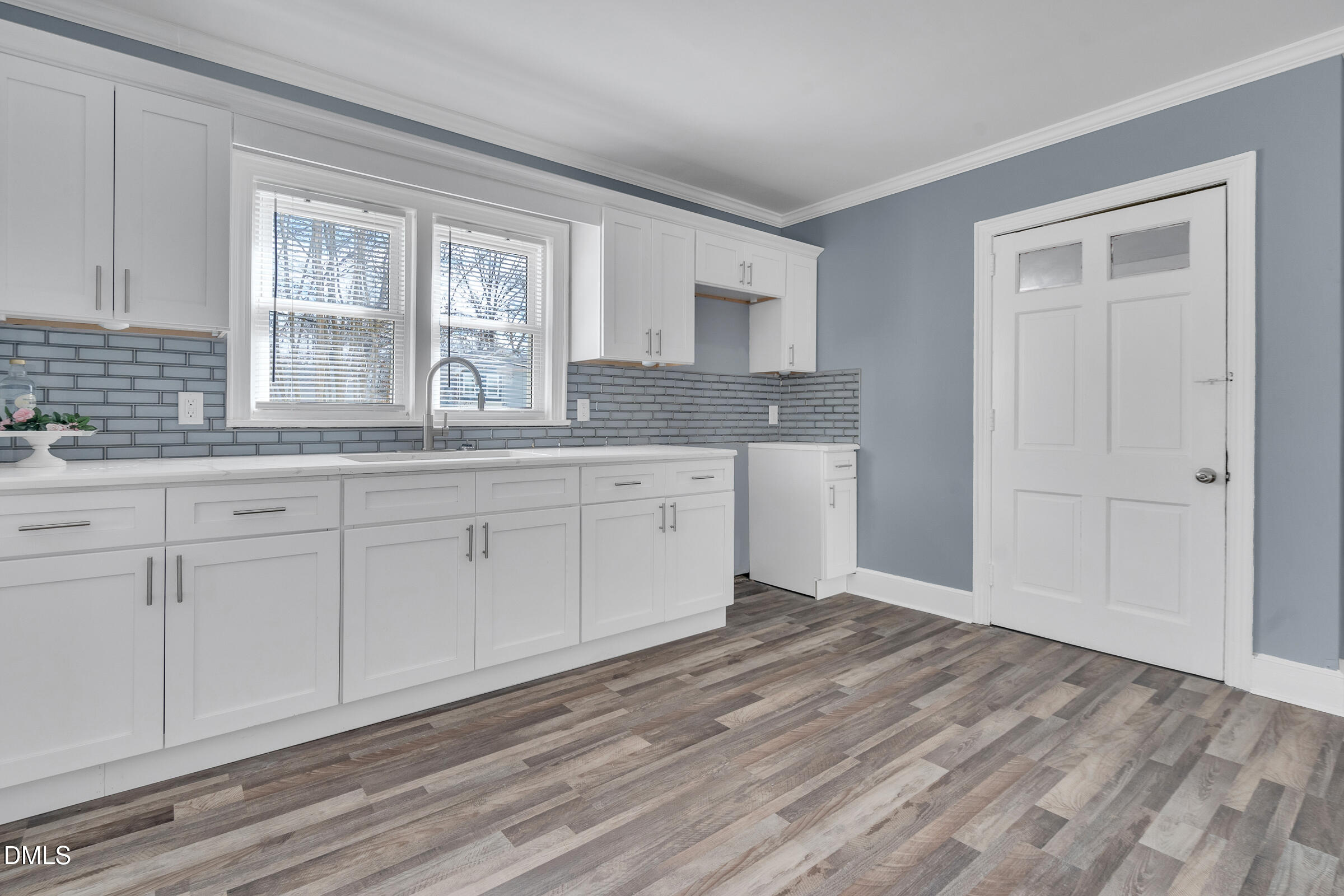 134 Nelson Street Durham, NC 27707 - Photo 12 of 25 a spacious bathroom with a granite countertop sink and a mirror
