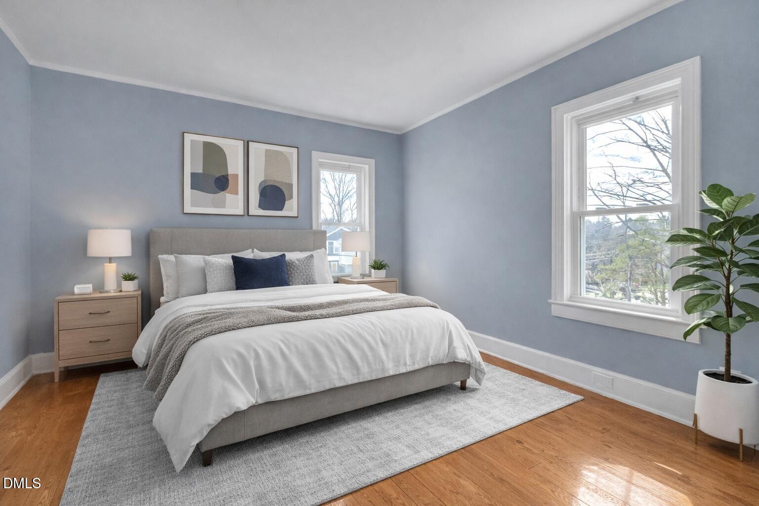 134 Nelson Street Durham, NC 27707 - Photo 19 of 25 a bedroom with a bed lamp and window
