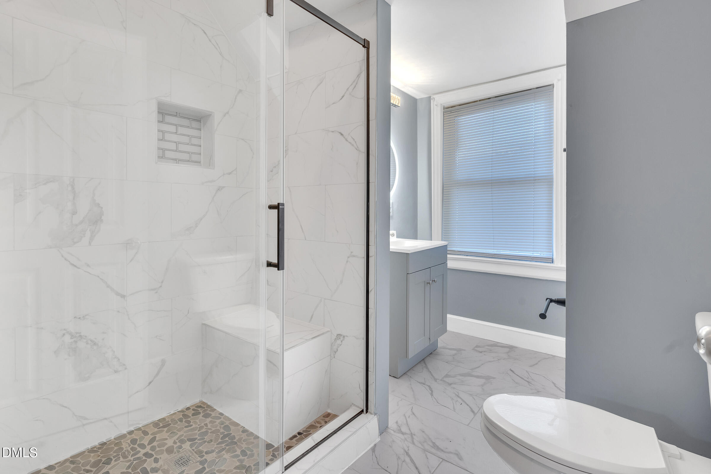 134 Nelson Street Durham, NC 27707 - Photo 22 of 25 a bathroom with a toilet and a shower