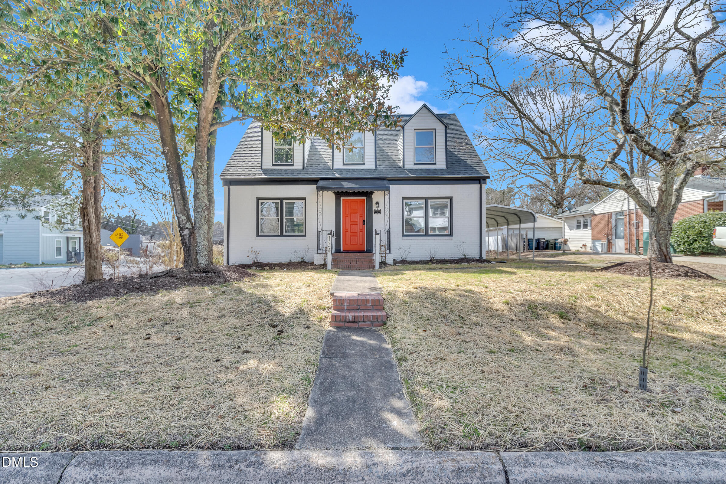 134 Nelson Street Durham, NC 27707 - Photo 2 of 25 a front view of a house with a yard and large tree