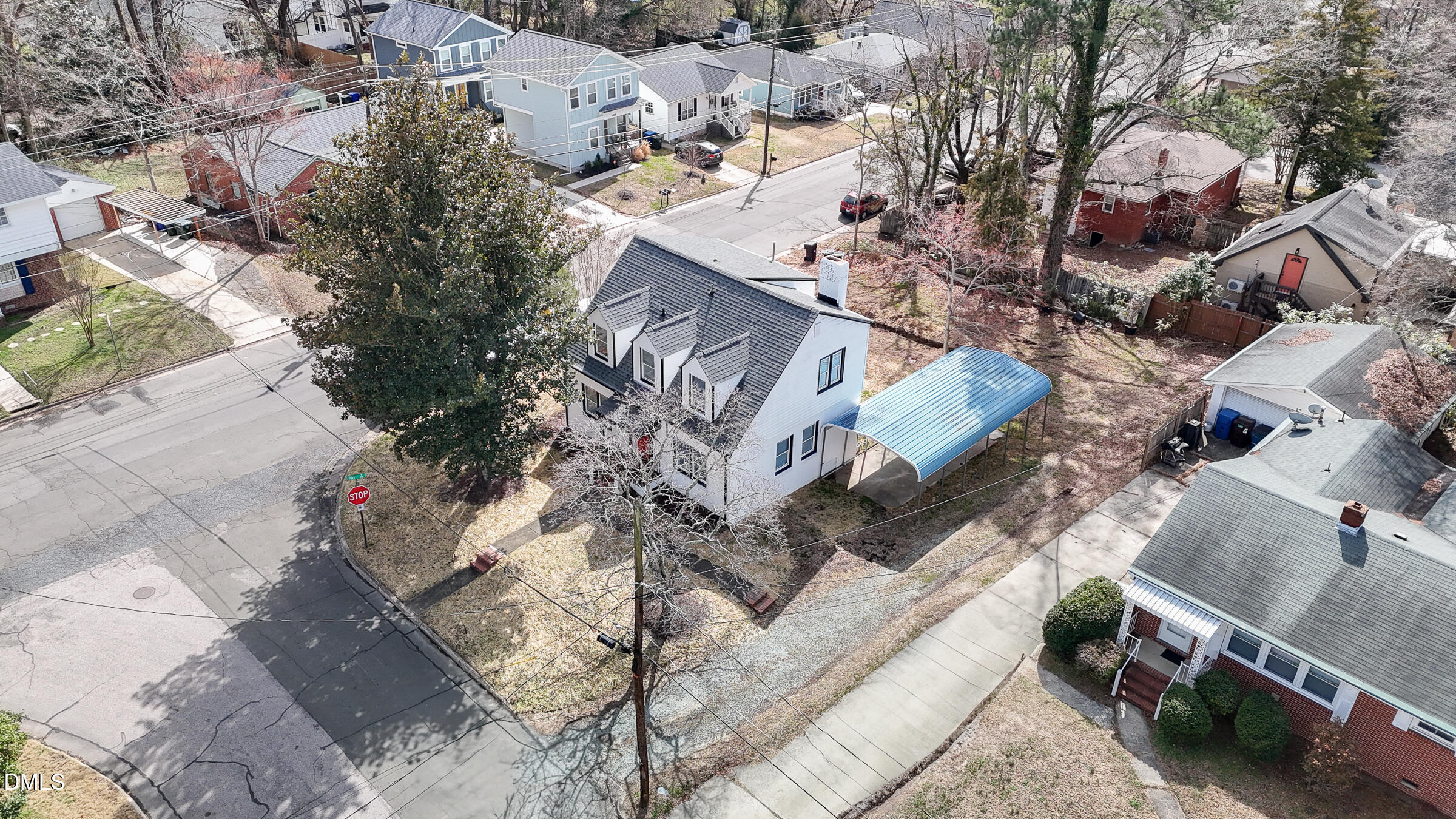 134 Nelson Street Durham, NC 27707 - Photo 3 of 25 an aerial view of a house with a yard and parking