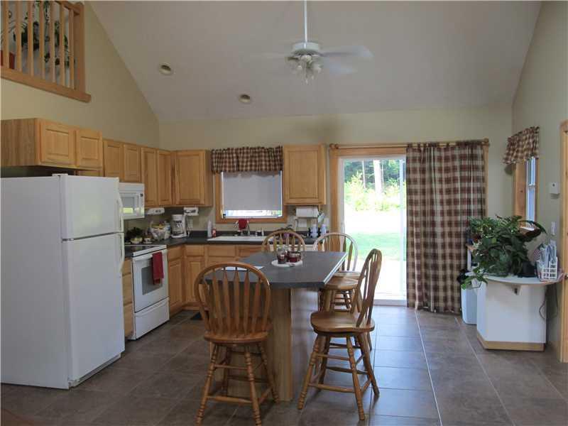 363 Pleasant View Ridge Road China, ME 04358 - Photo 8 of 35 Kitchen. Sliding glass doors lead to...