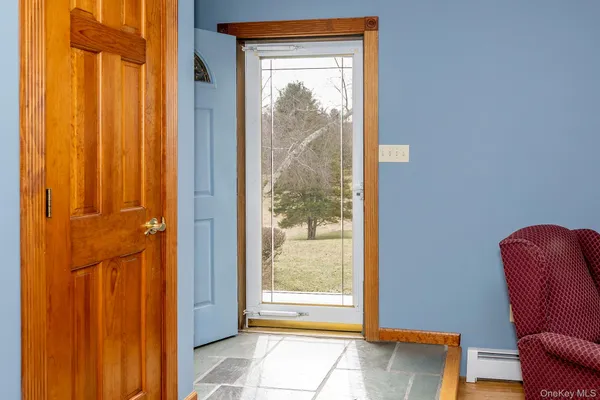 a view of a door and chair in a room