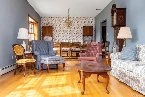 a living room with fireplace furniture and a flat screen tv