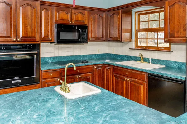 a view of a livingroom with furniture and wooden floor
