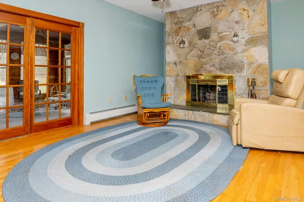 a view of a patio with a table and chairs