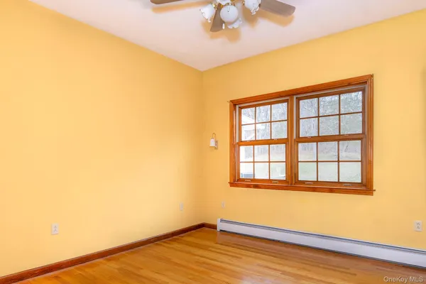 a bathroom with a sink toilet and mirror