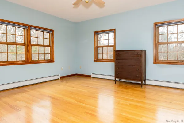 a bathroom with a shower and mirror