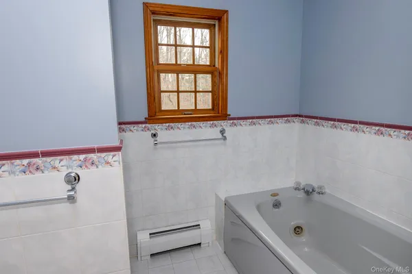 a bathroom with a sink and a window