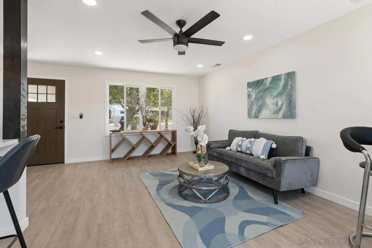 9257 Ruffin Road Santee, CA 92071 - Photo 11 of 28 a living room with furniture and a large window