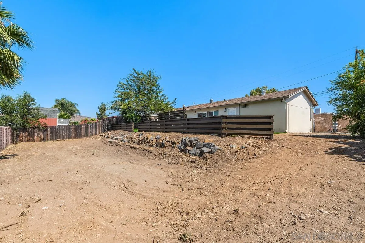 9257 Ruffin Road Santee, CA 92071 - Photo 23 of 28 a view of house with backyard and trees