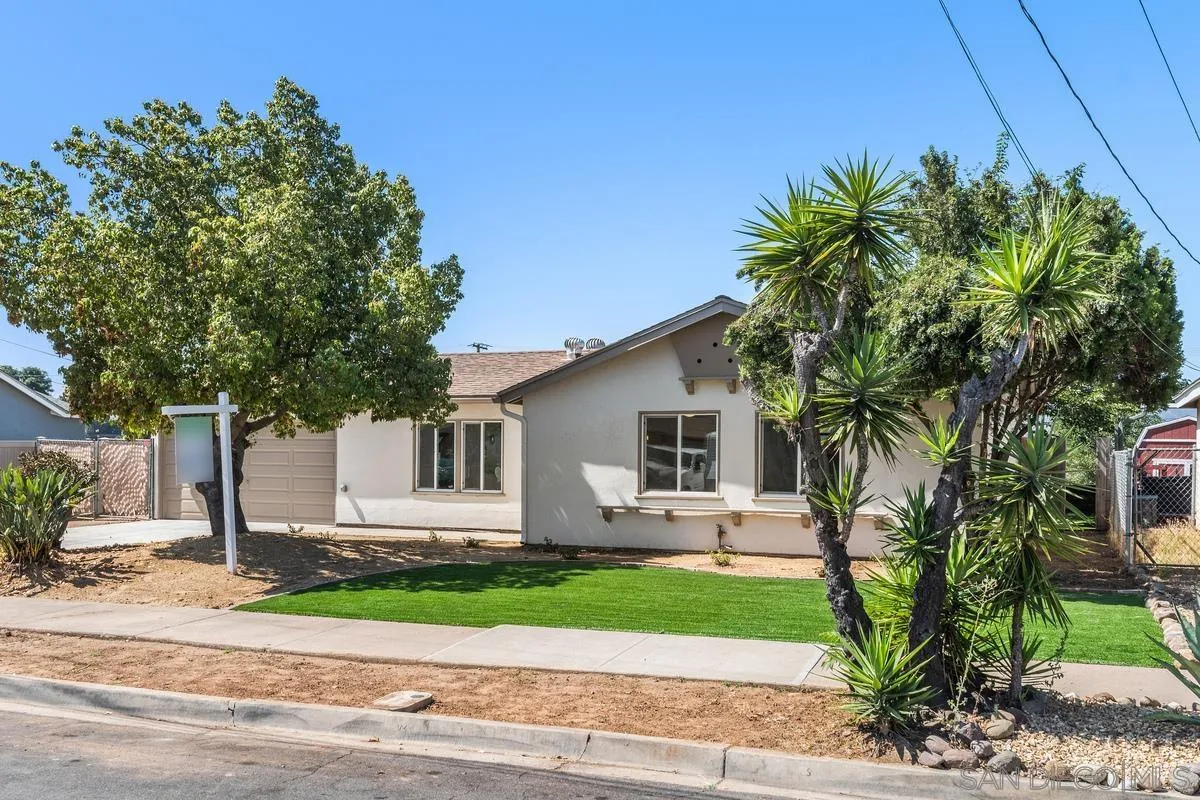 9257 Ruffin Road Santee, CA 92071 - Photo 25 of 28 a front view of a house with garden