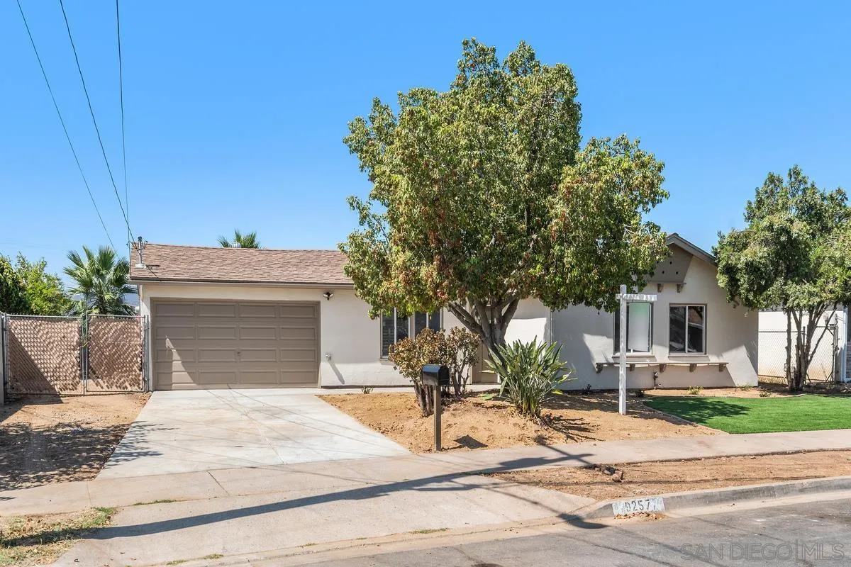 9257 Ruffin Road Santee, CA 92071 - Photo 27 of 28 a view of a white house with a tree and plants