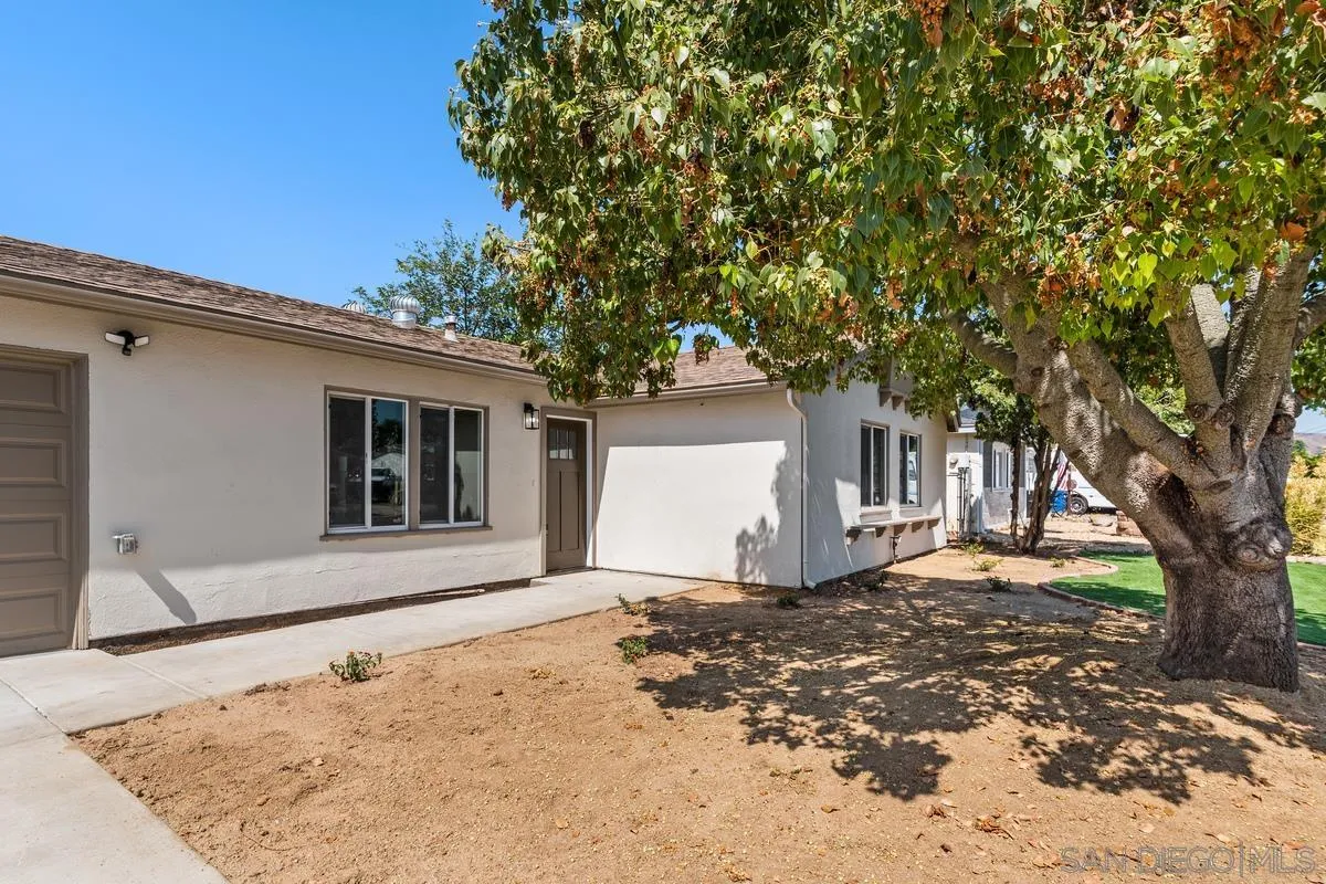 9257 Ruffin Road Santee, CA 92071 - Photo 28 of 28 front view of a house with a large tree